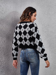 Argyle cropped cardigan in black and white acrylic with a crew neck and long sleeves.