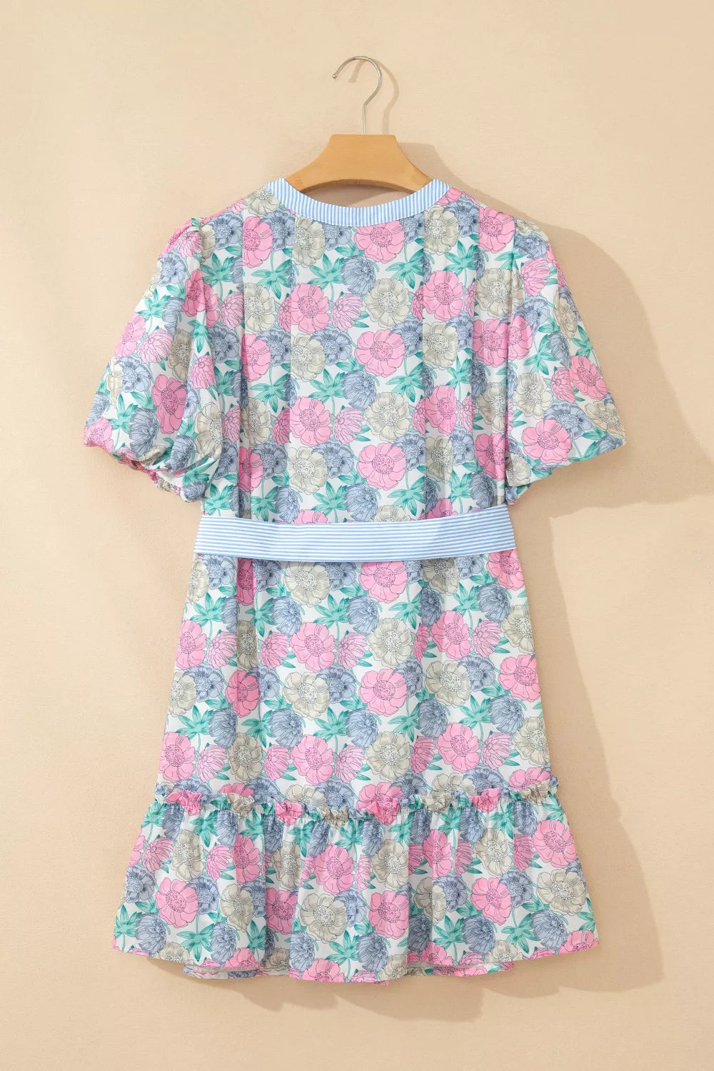 Floral mini dress with puff sleeves, contrast trim, and belted waist.