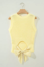 Yellow knit sweater vest with back cutout and large bow detail