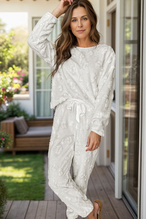 Textured leopard print loungewear set in white, featuring a crewneck top and drawstring pants.
