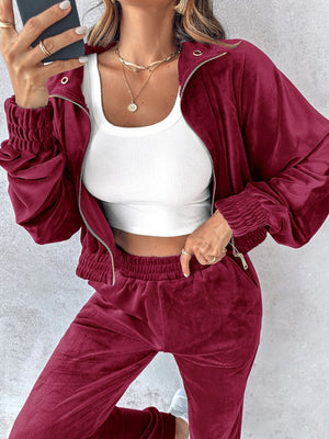 Burgundy velvet crop tracksuit jacket with zipper detail and elastic cuffs