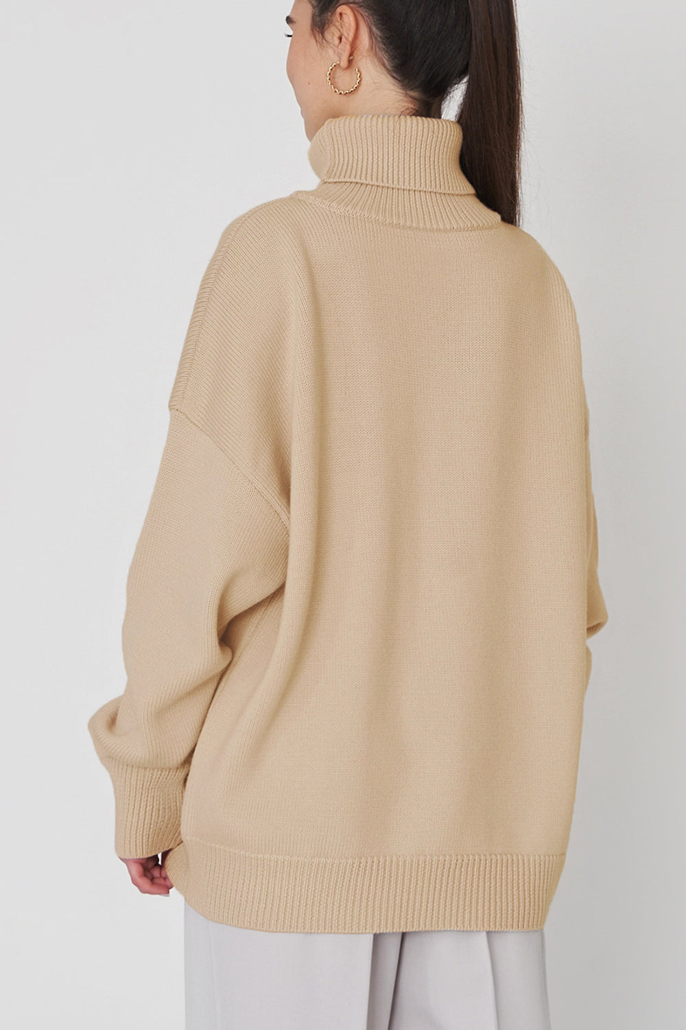 Relaxed roll-neck sweater in Khaki with a boxy knit cut and ribbed cuffs and hem.
