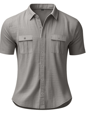 Grey short sleeve button-down shirt with two chest pockets and subtle plaid texture.