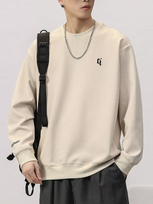 Plus-size round-neck sweatshirt in Rice Apricot with embroidered logo and text detail.
