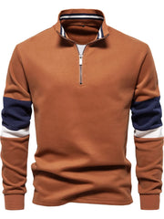 Caramel colorblock zip-neck sweatshirt with navy and white sleeve details.