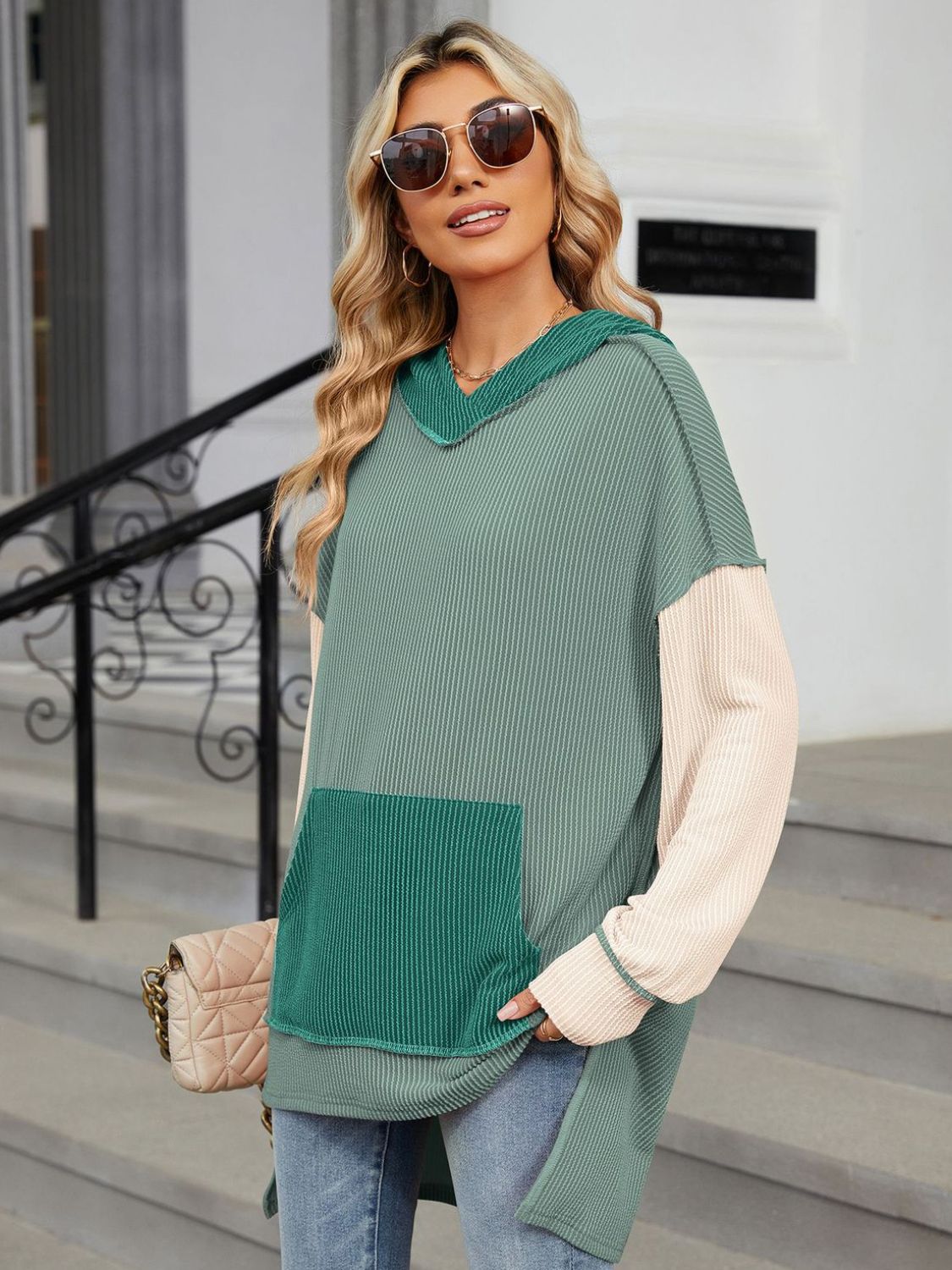 Waffle knit colorblock tunic with hood and pocket in green and cream, long sleeves.