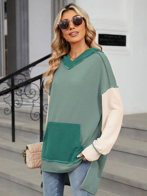 Waffle knit colorblock tunic with hood and pocket in green and cream, long sleeves.