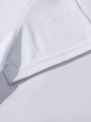 White t-shirt detail showing hem and sleeve seam.
