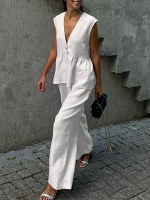 White sleeveless peplum top and wide-leg pants set, breathable cotton blend, V-neck, casual women's two-piece outfit.