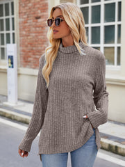Ribbed turtleneck sweater in mocha with side slits and long sleeves.