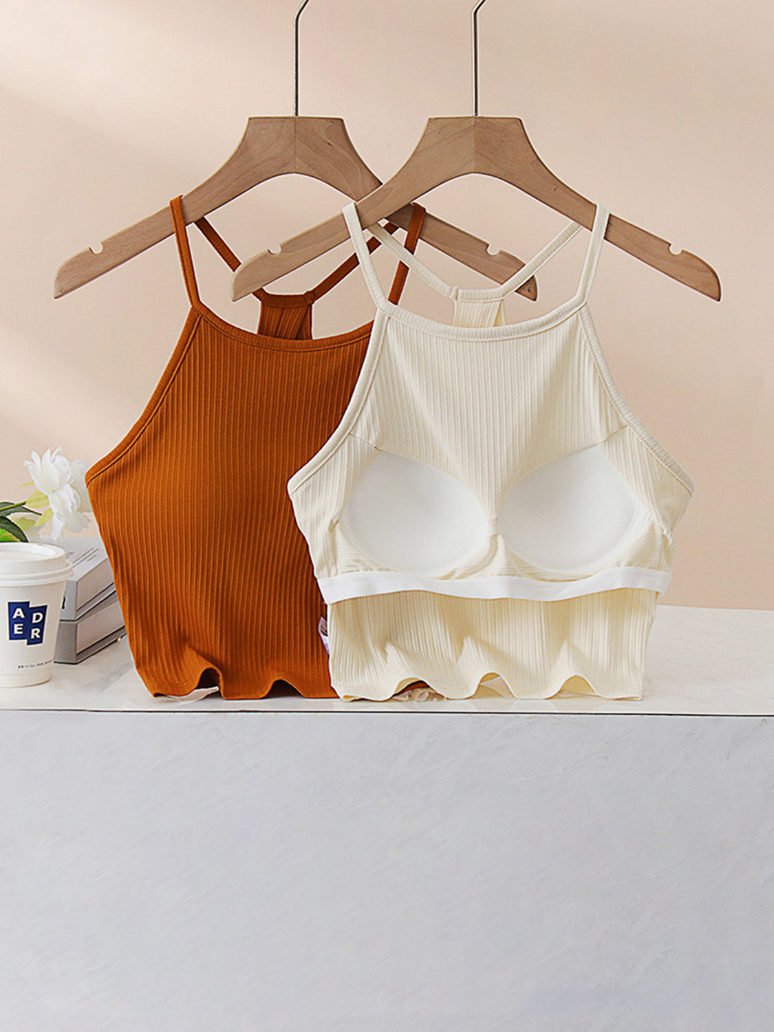Ribbed racerback crop top in caramel and cream with built-in bra cups and lettuce hem.