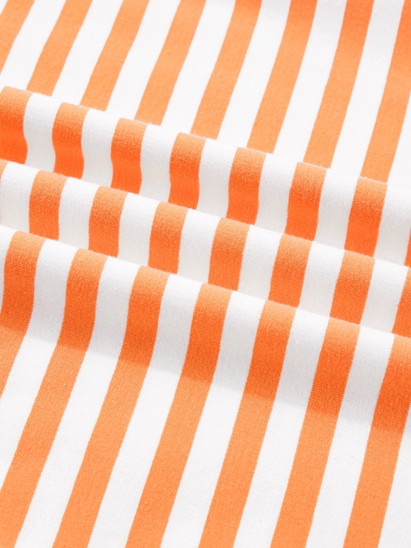 Oversized cotton t-shirt with orange and white stripes, 3/4 sleeves.
