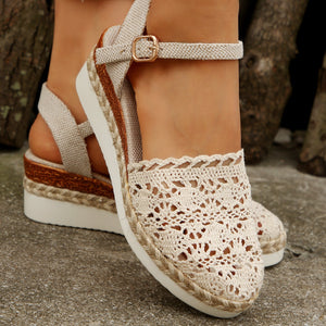 Ivory crochet espadrille wedge sandals with adjustable ankle strap and jute trim.