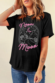 Black t-shirt with a desert neon moon graphic and pink text.
