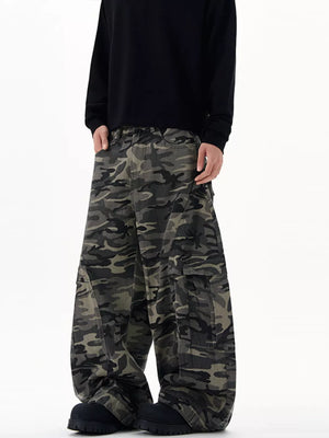 Oversized camouflage cargo sweatpants with multiple pockets and a relaxed fit.