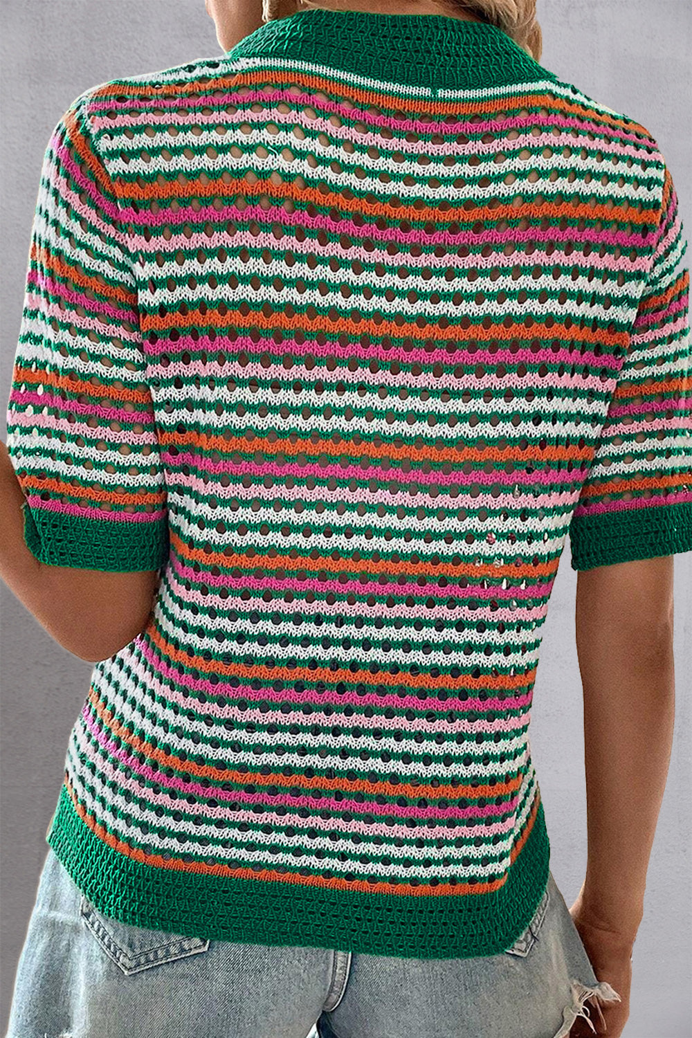 Open-knit striped mock neck top with green trim and short sleeves.