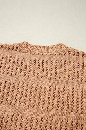 Peach openwork knit sweater with crew neck and elbow sleeves.