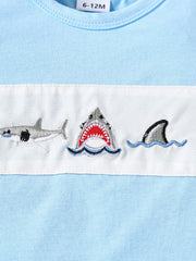 Baby blue cotton t-shirt with embroidered sharks and waves detail