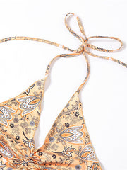 Paisley print halter top in tangerine with ruched detail and tie neck.