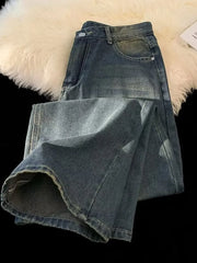Men's plus-size vintage wash wide-leg jeans in medium blue denim, folded to show hem detail.