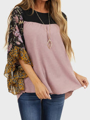 Textured panel blouse in mauve with floral and leopard print flutter sleeves.