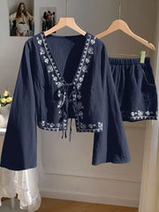 Navy embroidered tie-front top with bell sleeves and matching shorts set