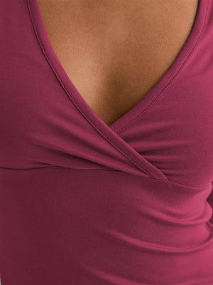 Burgundy crossover ruched fitted t-shirt with a V-neckline.