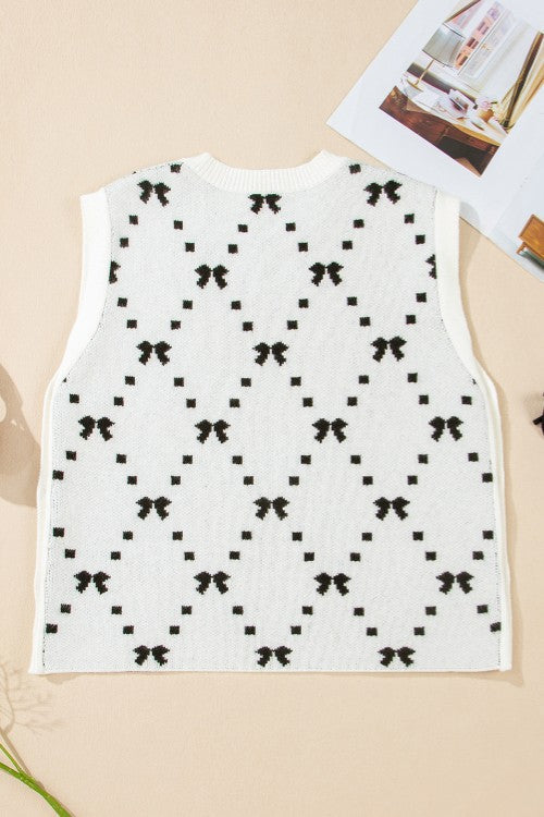 White knit tank sweater with black diamond bow pattern