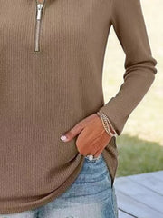 Ribbed knit half-zip sweater in khaki with long sleeves.