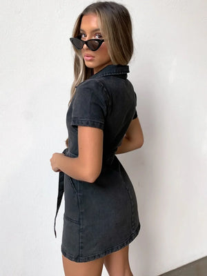 Belted denim shirtdress in dark gray with short sleeves and collar, cinched waist.
