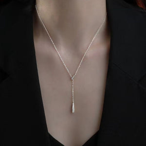Sterling silver Y-shaped pendant necklace with a delicate, draped chain and teardrop charm.
