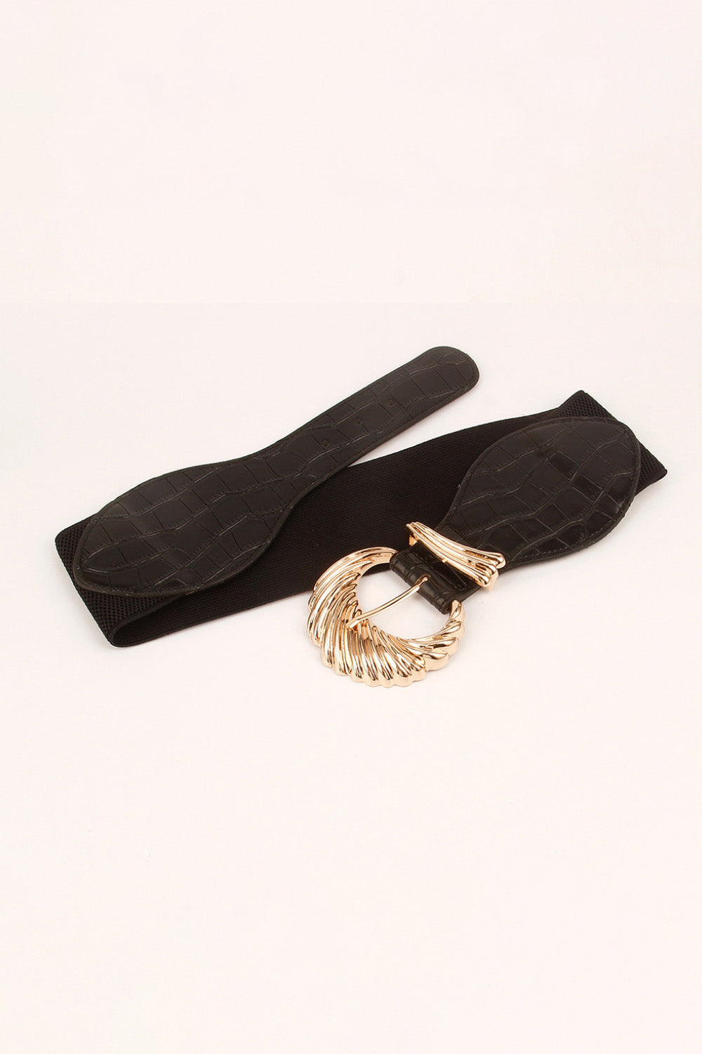 Black croc-embossed elastic belt with sculptural gold buckle detail