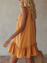 Turmeric tie-front mini dress with ruffle hem and sleeveless design.