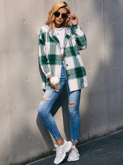 Oversized green plaid shacket with hood, button front, and white contrast trim.