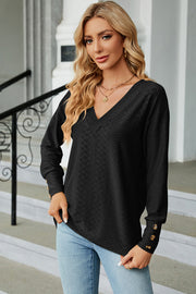 Black diamond-textured V-neck blouse with button cuff sleeves