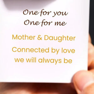 Double band heart and infinity ring in silver, with "Mother & Daughter" inscription.