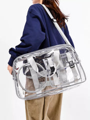Chic clear PVC travel bag with grey accents and adjustable strap.