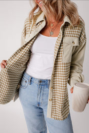 Houndstooth corduroy patchwork shacket in beige with button front and chest pockets.