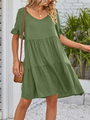 Army green tiered mini dress with ruffled sleeves and V-neck.
