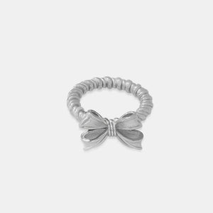 Textured silver ring with a bow knot detail and twisted band.