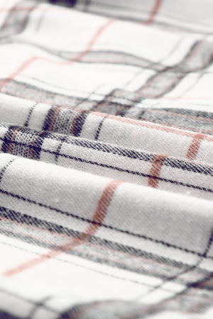 Oversized white shacket with plaid pattern in black and rust.