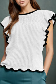 White knit top with black scalloped trim and ruffle sleeves