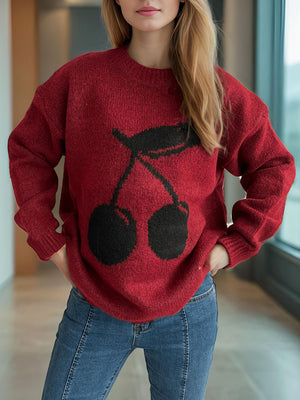 Burgundy knit sweater with black cherry motif, crew neck, long sleeves.