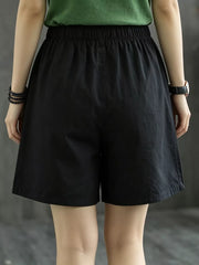 Black chino shorts with elastic waist and relaxed fit.