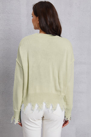 Light Yellow knit sweater with distressed hem and cuffs.