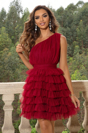 Red tulle ruffle one-shoulder mini dress with tiered skirt and ruched bodice.