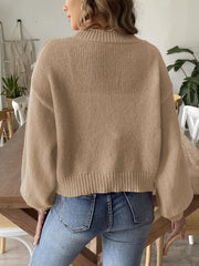 Tan bubble sleeve cardigan with pearl buttons and ribbed cuffs.