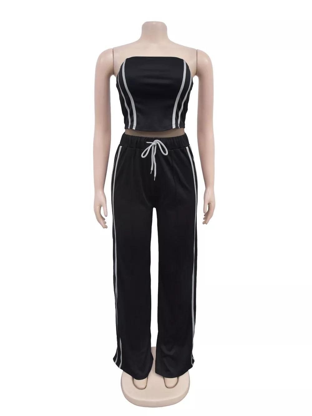 Black tube top and wide-leg pant set with white stripe detail and drawstring waist.
