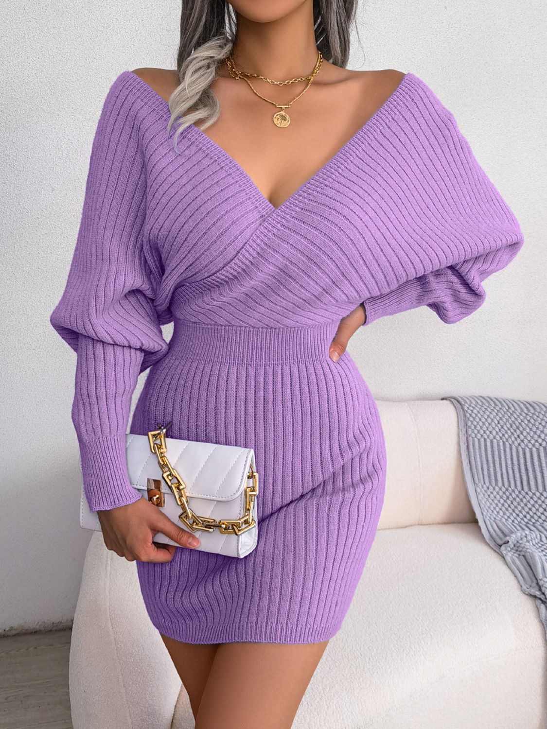 Heliotrope purple acrylic wrap knit bodycon mini dress with long sleeves and a deep V-neck.