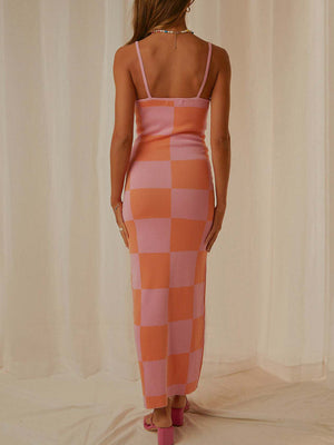 Geometric knit maxi slip dress in pink and orange checkerboard pattern with spaghetti straps.